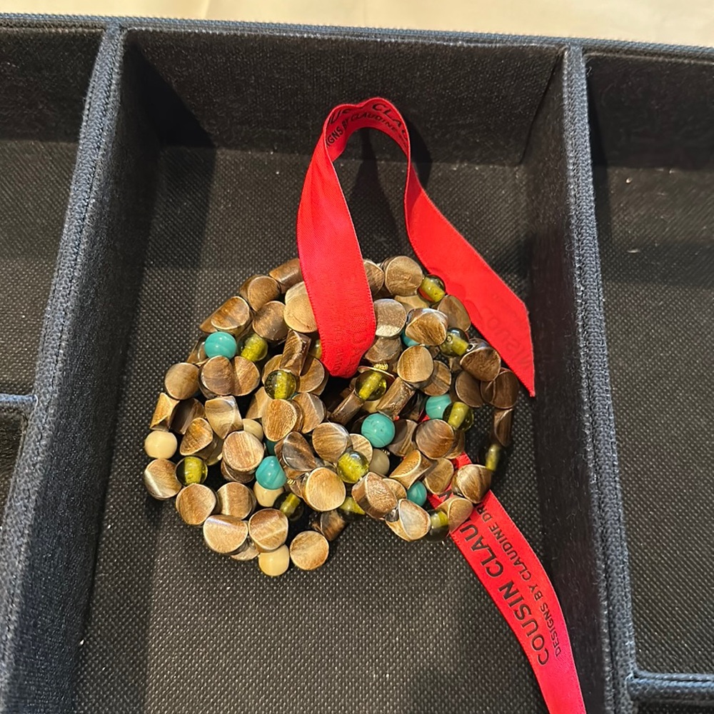 Cousin Claudine brown and green beaded bracelet set.  8 pieces.